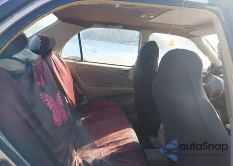 1999 Toyota Corolla Le z USA, uszkodzony, nr VIN 2T1BR12E6XC161465